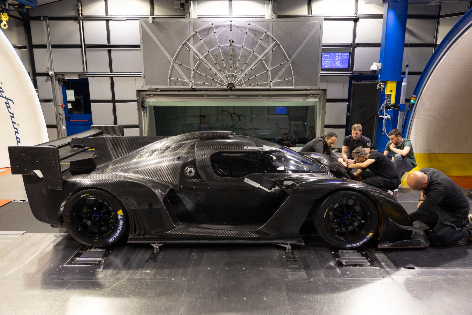 Team working on the Kalana between runs at the Pininfarina tunnel