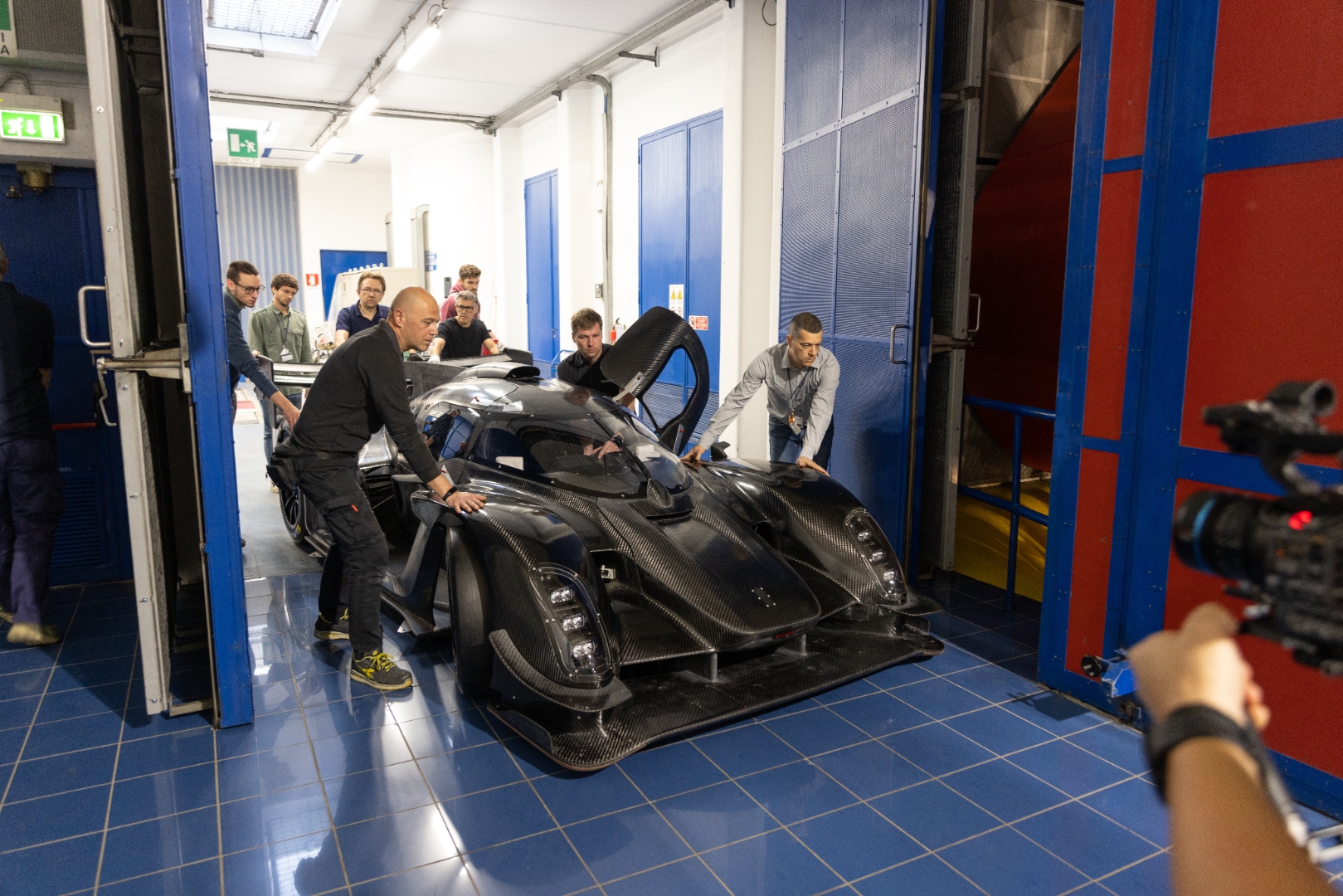 The Kalana being pushed into the Pininfarina wind tunnel by the team