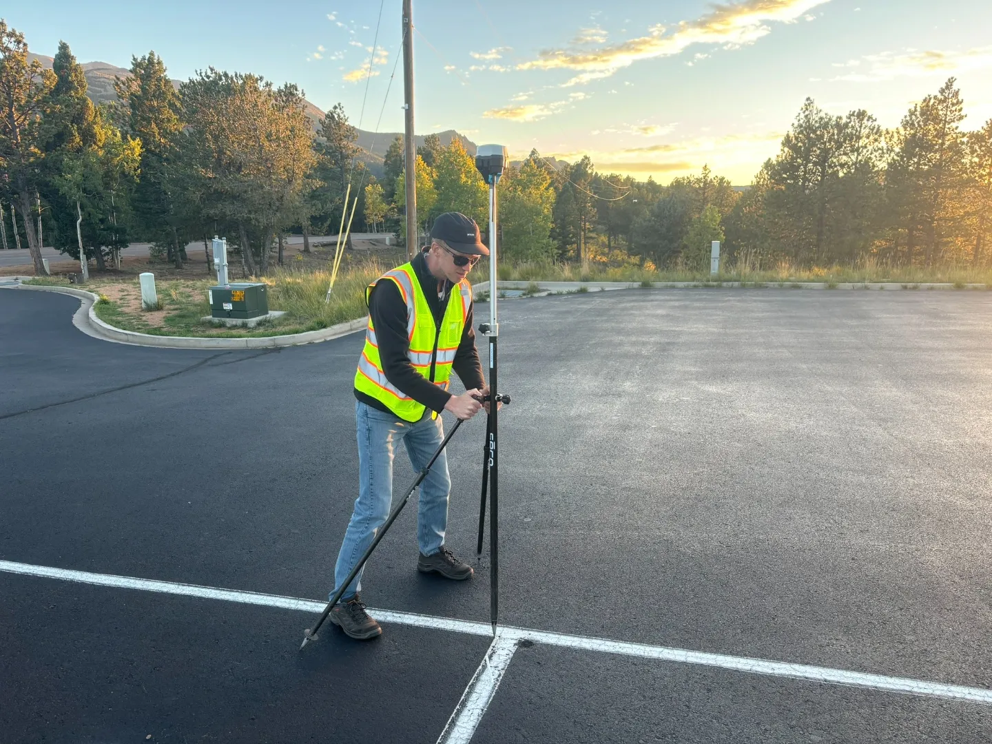 Surveyor calibrating GPS rover on the Pikes Peak start line cross markers