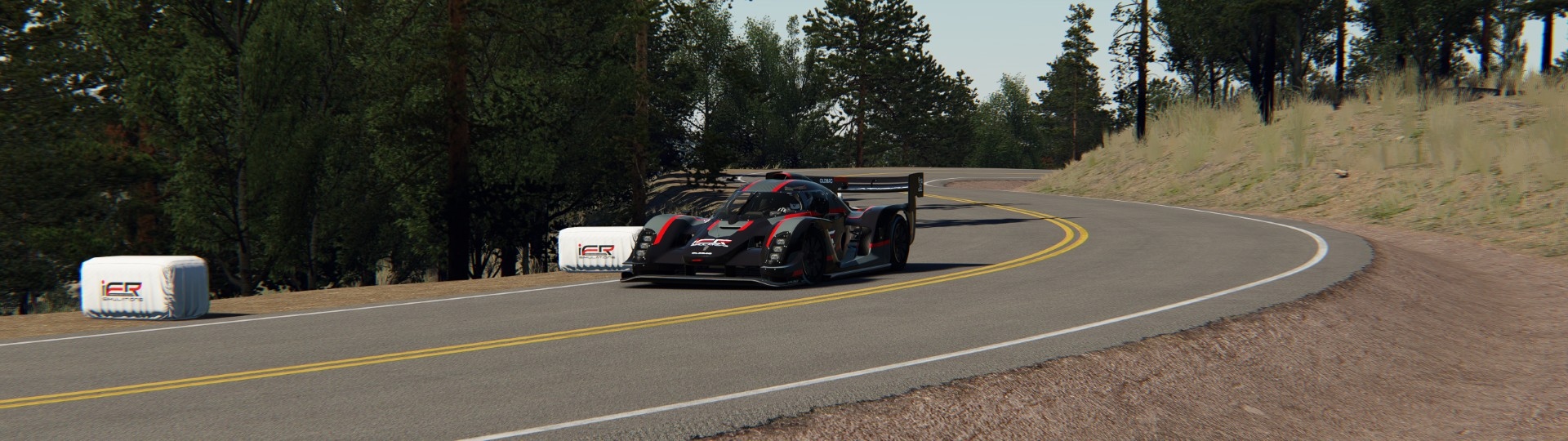 Oldbac Kalana development mule attacking Pikes Peak Highway in Assetto Corsa simulation