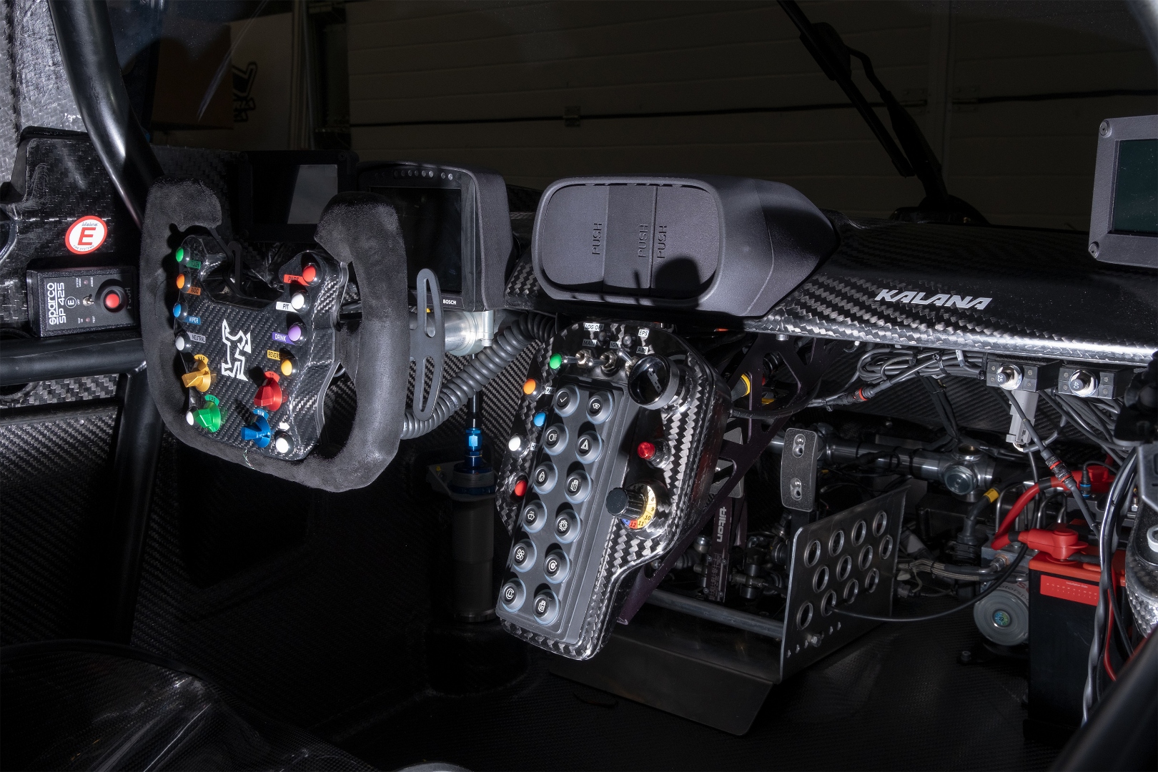 Kalana cockpit — steering wheel, button panel, and data acquisition wiring